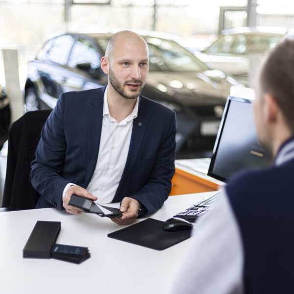 salesman showing something to a customer