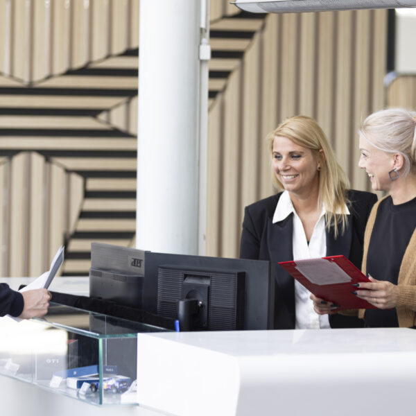 3 people at the service desk